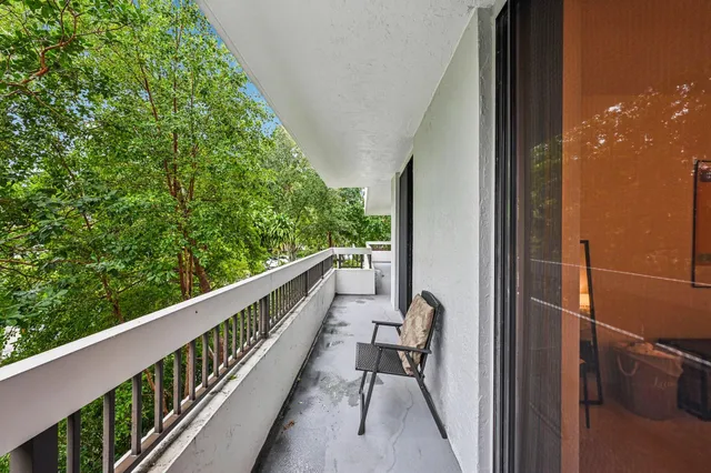 a view of a garden with a building in front of it