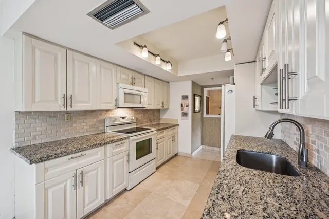 a bed room with a bed and a chair