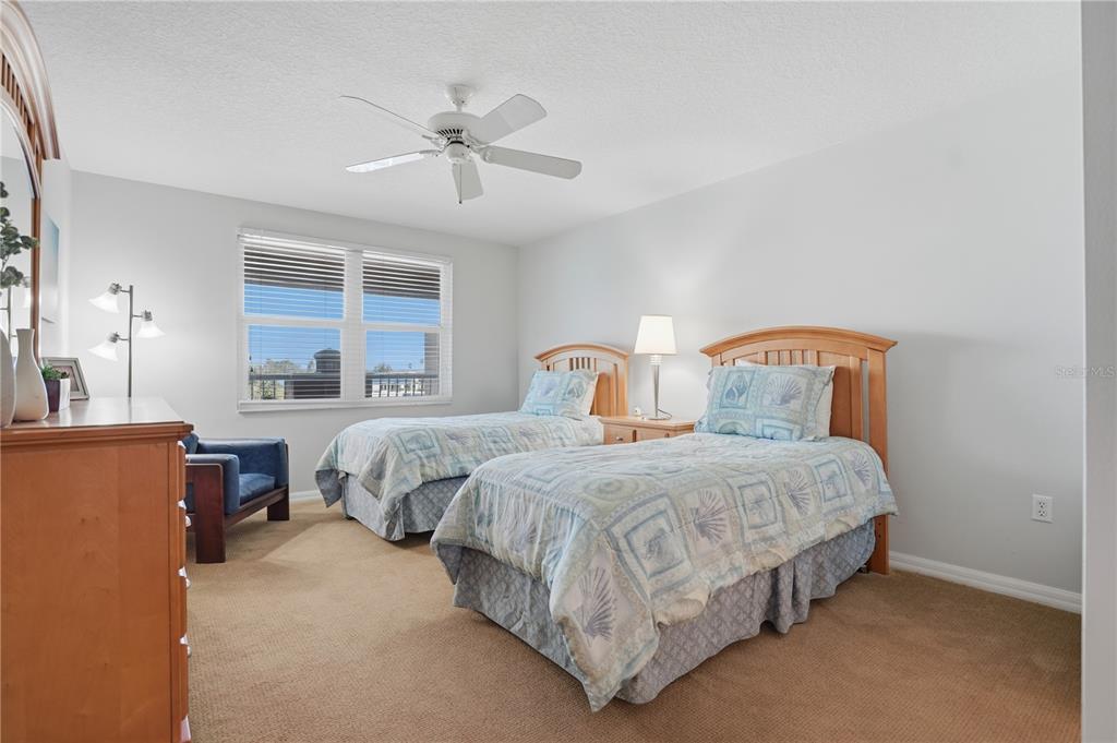 16326 Gulf Boulevard, Unit 307 Redington Beach, FL 33708 - Photo 25 of 43 a bedroom with bed and window
