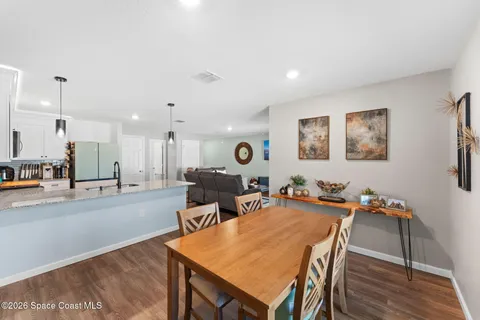 a view of a dining room with furniture