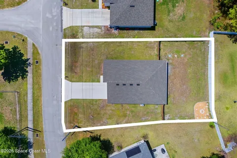 aerial view of a house with a swimming pool