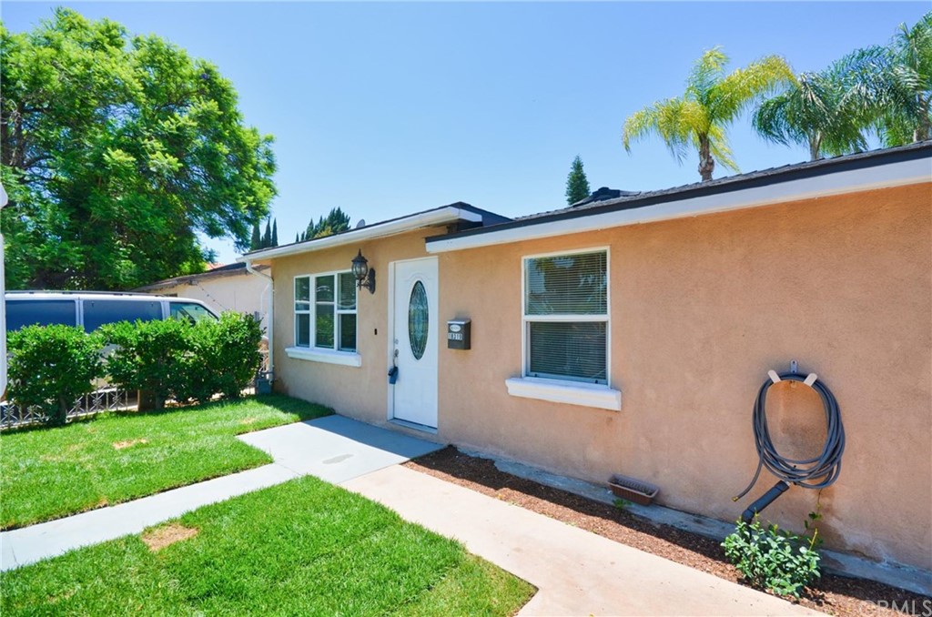 18319 Norwalk Boulevard Artesia, CA 90701 - Photo 1 of 39 a front view of a house with garden