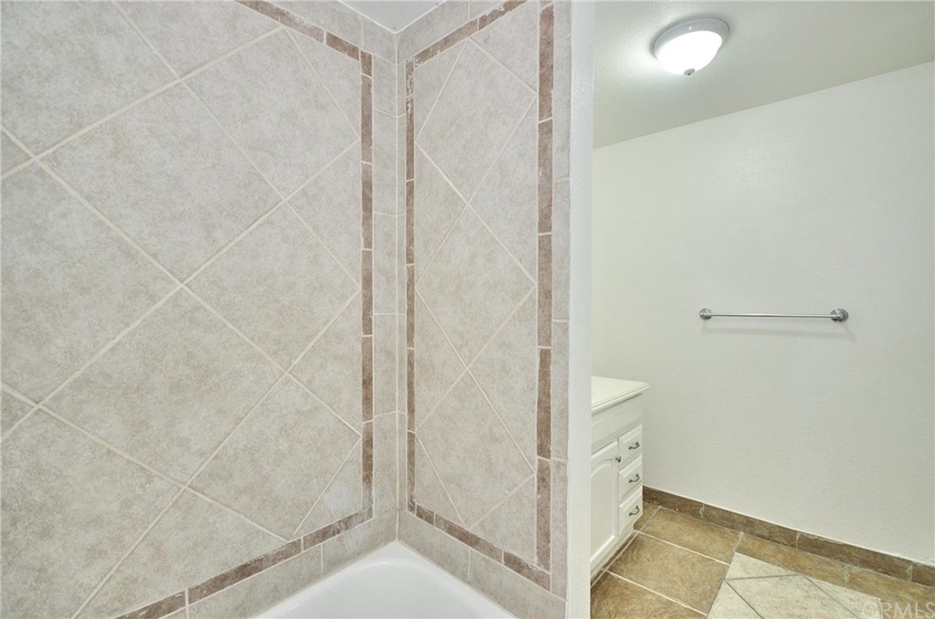 18319 Norwalk Boulevard Artesia, CA 90701 - Photo 11 of 39 a bathroom with a shower and a sink