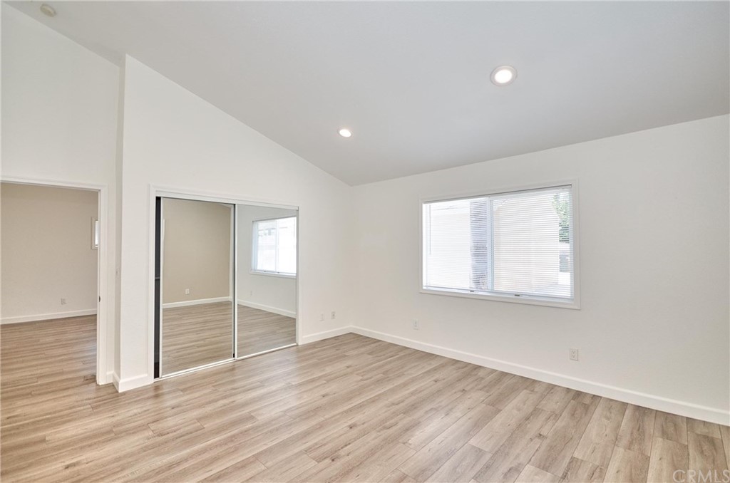 18319 Norwalk Boulevard Artesia, CA 90701 - Photo 21 of 39 wooden floor in an empty room with a window