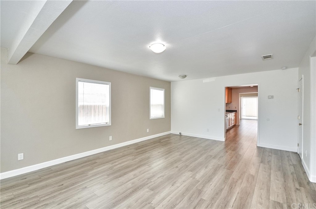 18319 Norwalk Boulevard Artesia, CA 90701 - Photo 4 of 39 wooden floor in an empty room with a window