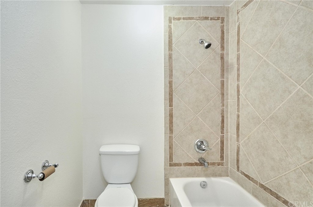 18319 Norwalk Boulevard Artesia, CA 90701 - Photo 10 of 39 a bathroom with a sink a toilet and shower