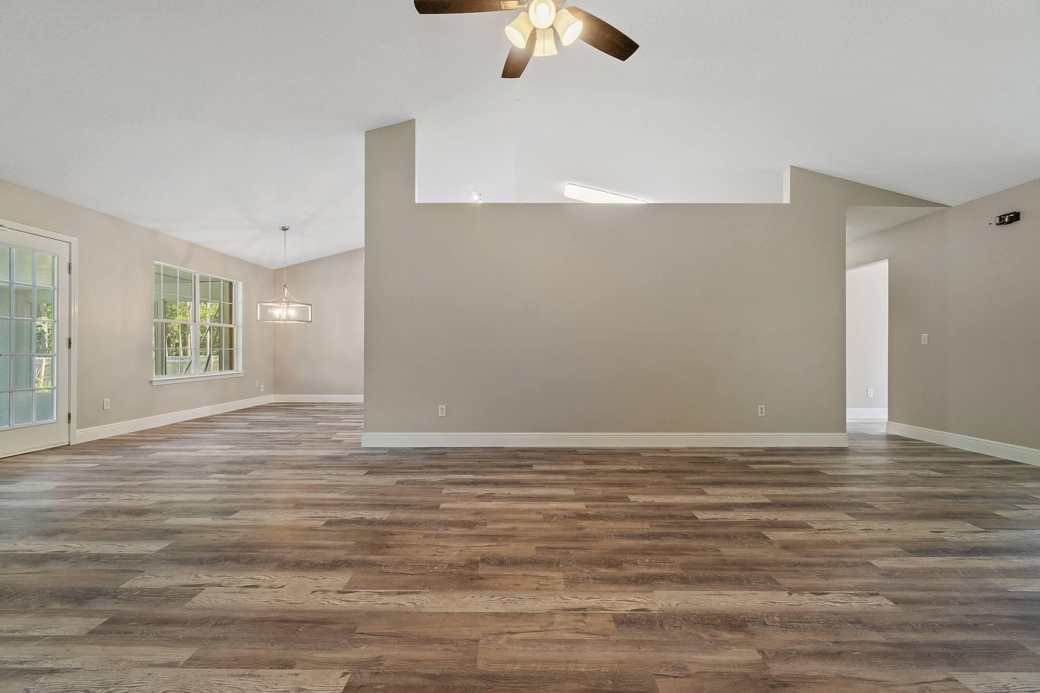 2005 Cardinal Lane Navarre, FL 32566 - Photo 13 of 63 a view of an empty room with window and wooden floor