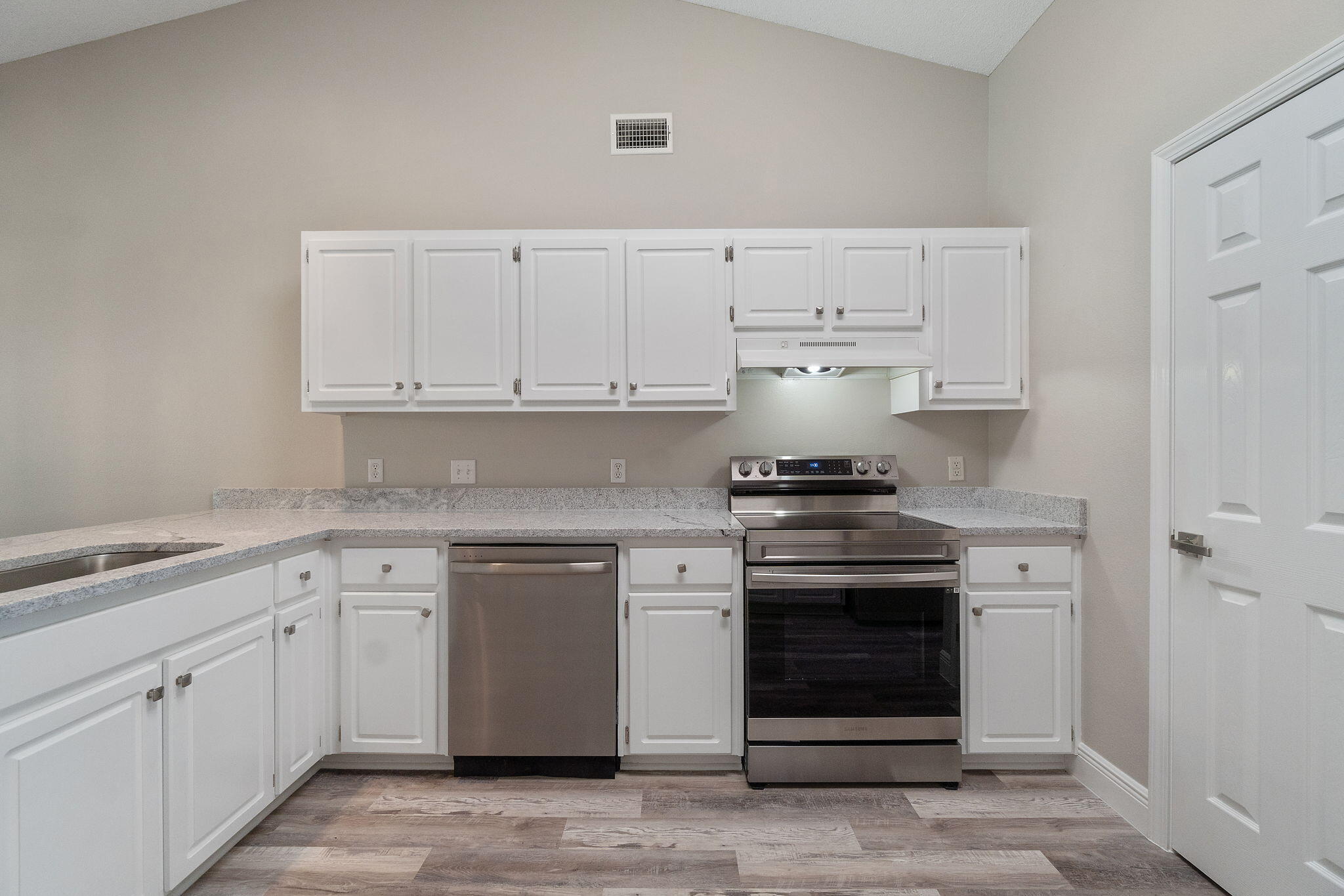2005 Cardinal Lane Navarre, FL 32566 - Photo 20 of 63 a kitchen with cabinets appliances and a sink