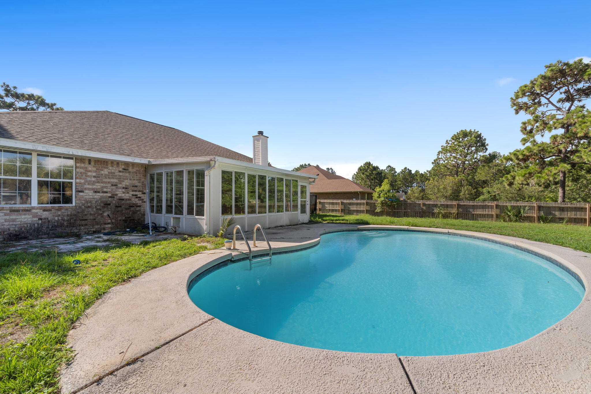 2005 Cardinal Lane Navarre, FL 32566 - Photo 2 of 63 a view of outdoor space yard swimming pool and patio