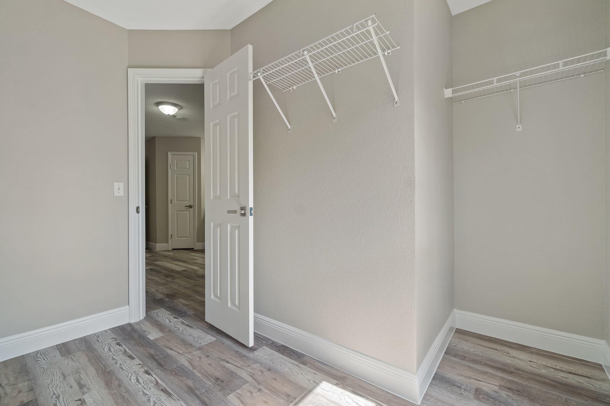 2005 Cardinal Lane Navarre, FL 32566 - Photo 31 of 63 an empty room with wooden floor and entrance