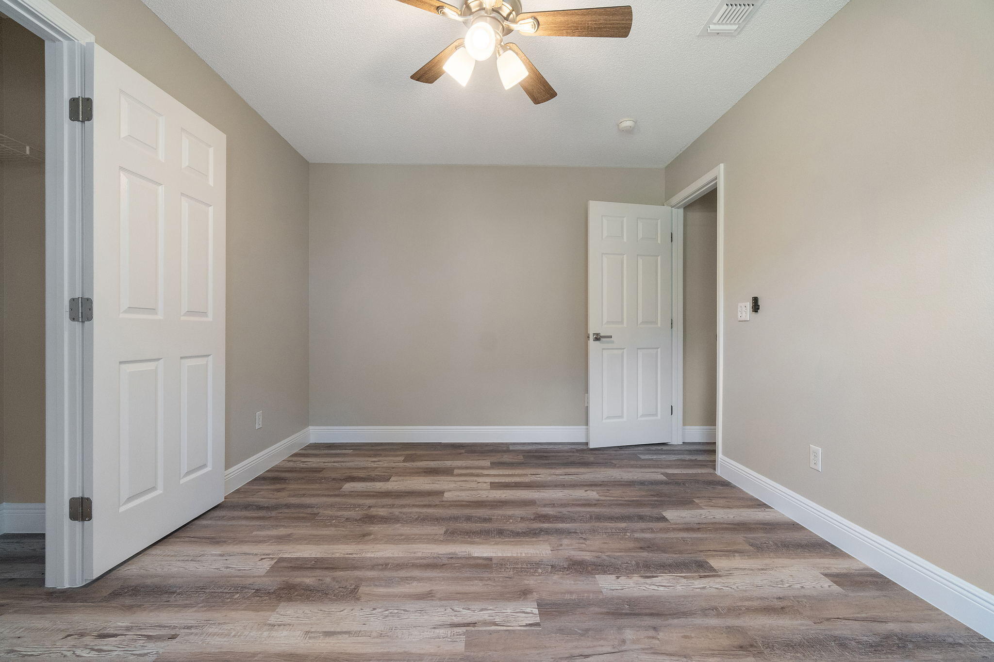 2005 Cardinal Lane Navarre, FL 32566 - Photo 34 of 63 a view of an empty room with wooden floor