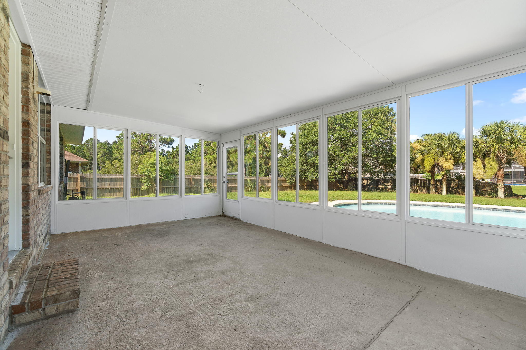 2005 Cardinal Lane Navarre, FL 32566 - Photo 41 of 63 a view of a house with a swimming pool