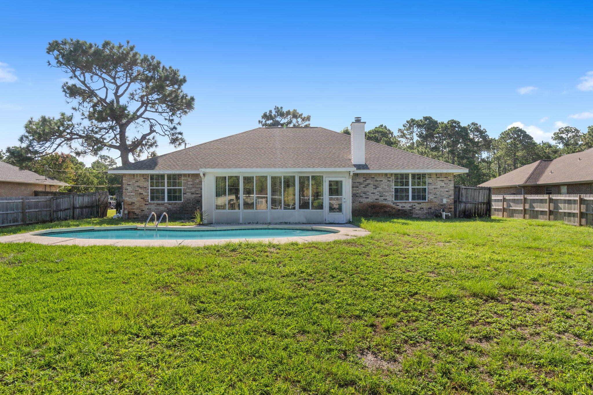 2005 Cardinal Lane Navarre, FL 32566 - Photo 42 of 63 a front view of house with yard and seating area