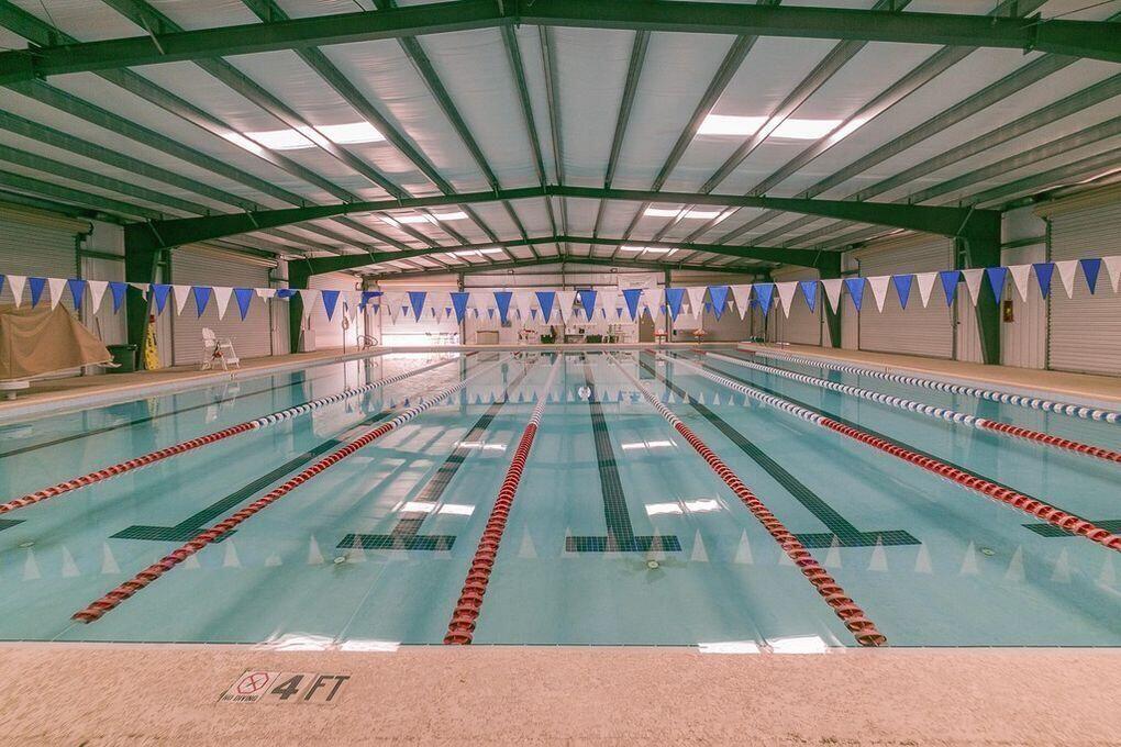 2005 Cardinal Lane Navarre, FL 32566 - Photo 57 of 63 a view of a swimming pool with a patio