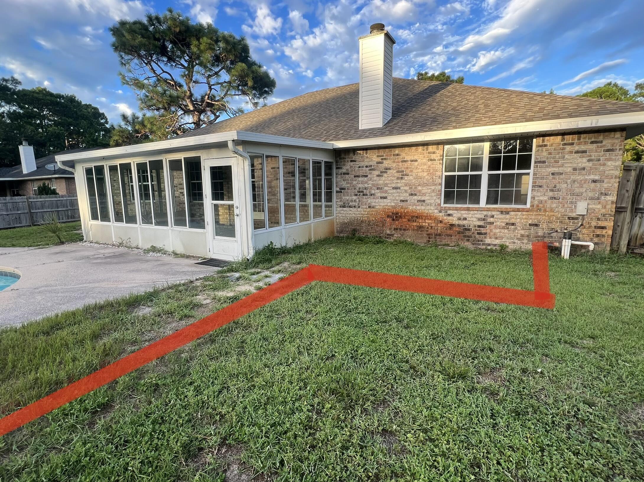 2005 Cardinal Lane Navarre, FL 32566 - Photo 61 of 63 a front view of a house with a yard and porch
