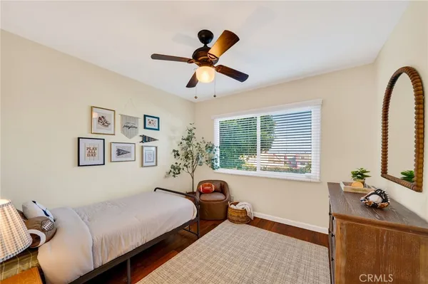 a bed room with a bed and a large window