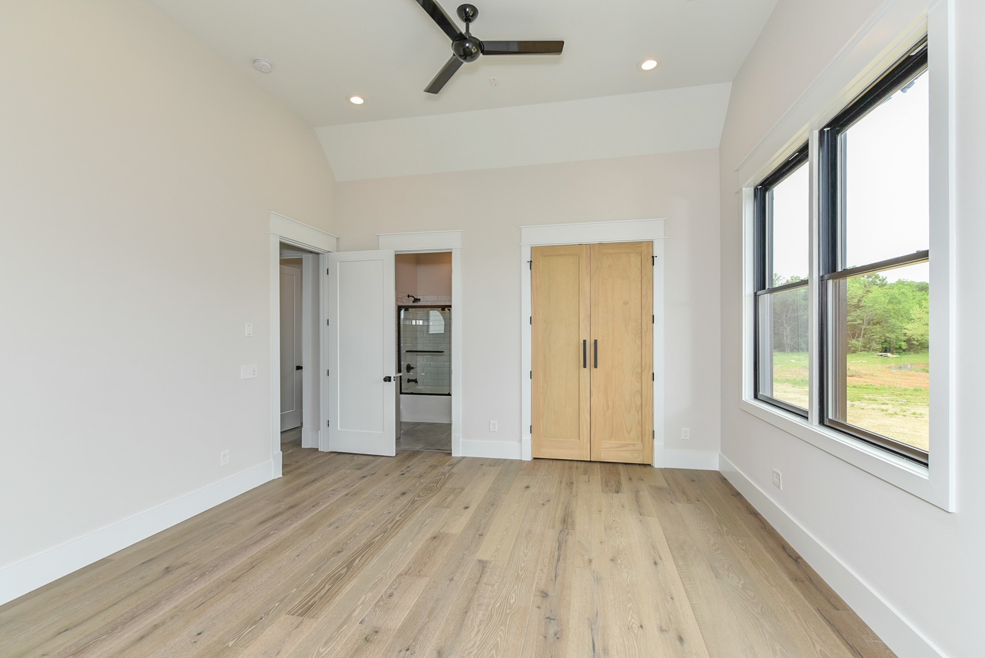 4282 Alsup Mill Road Lascassas, TN 37085 - Photo 36 of 46 an empty room with wooden floor and windows