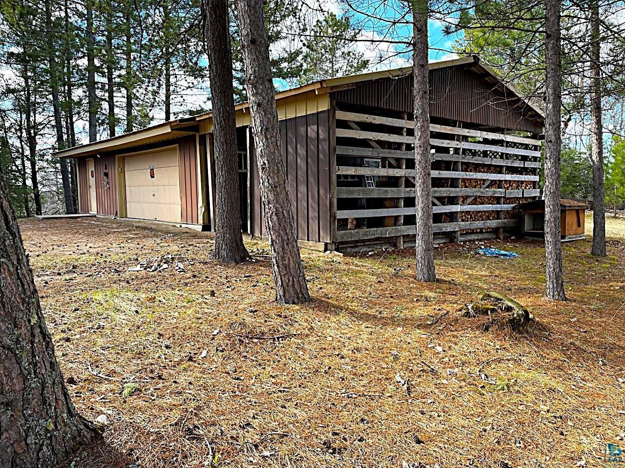 1480 Maijala Road Ely, MN 55731 - Photo 4 of 58 26' x 36' metal garage and 12' x 26' open end lean-to shed.