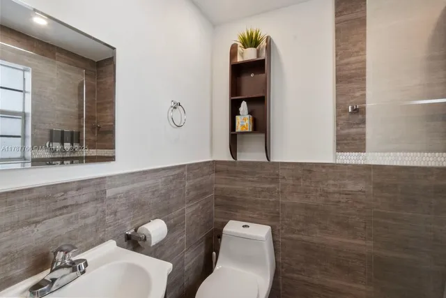 a bathroom with a toilet and a sink