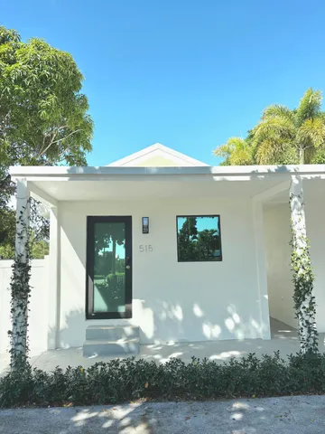 a view of a house with a tree
