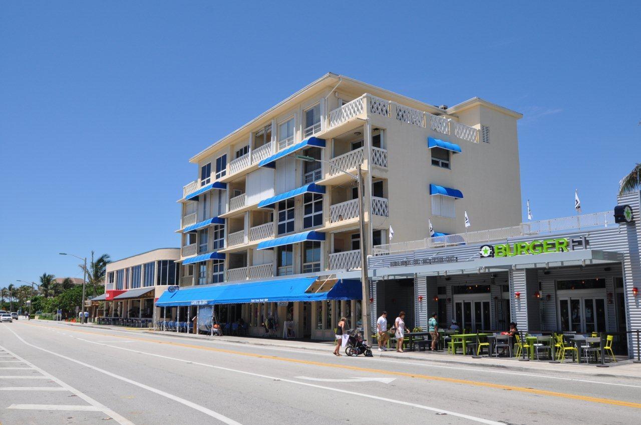 515 Northwest 1st Street, Unit 1 Delray Beach, FL 33444 - Photo 32 of 35 a group of cars parked in front of building
