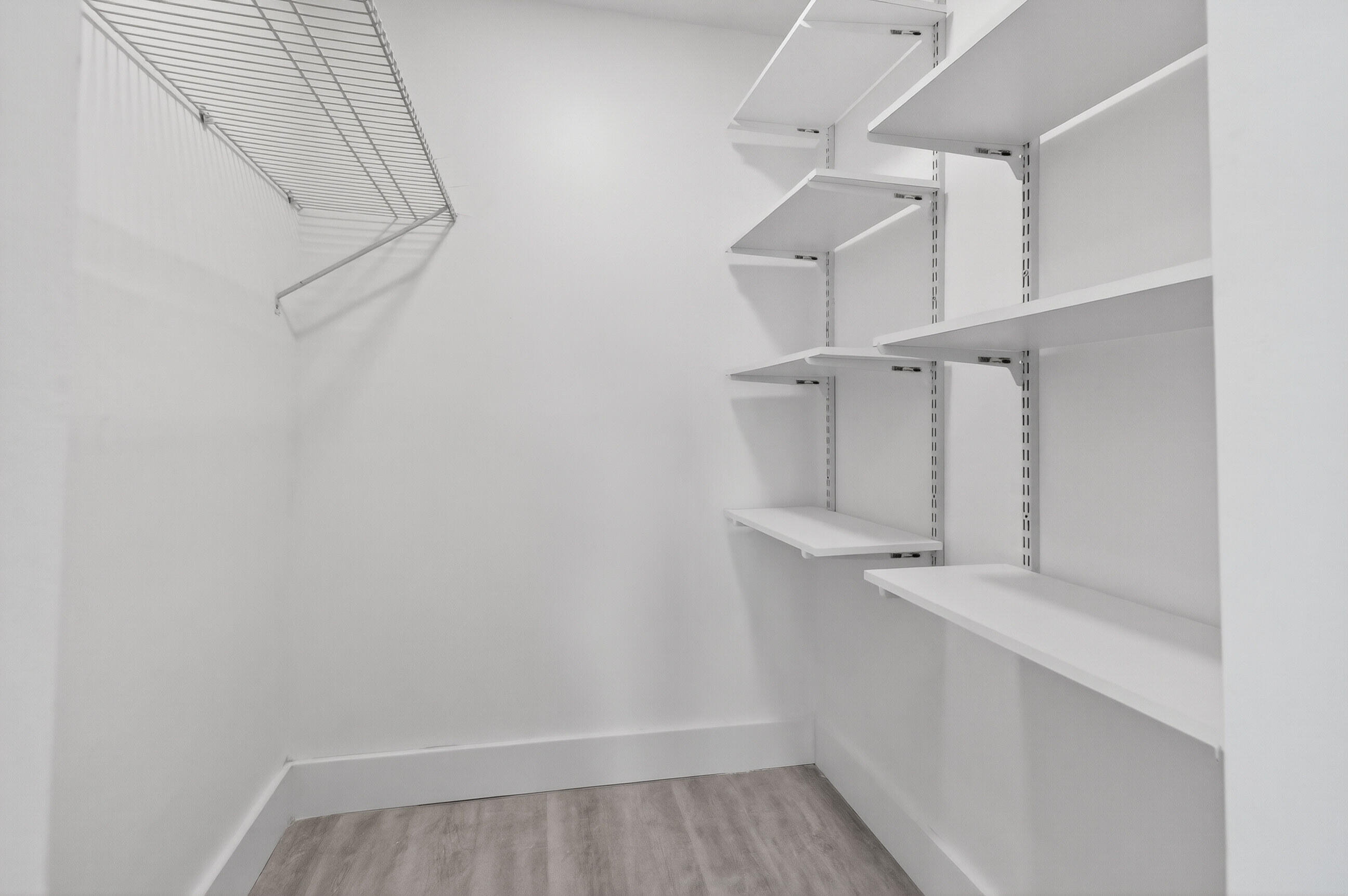 515 Northwest 1st Street, Unit 1 Delray Beach, FL 33444 - Photo 9 of 35 a view of walk in closet with racks on the wall