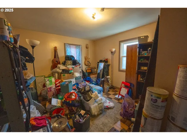 a view of a backyard with plants and a garden