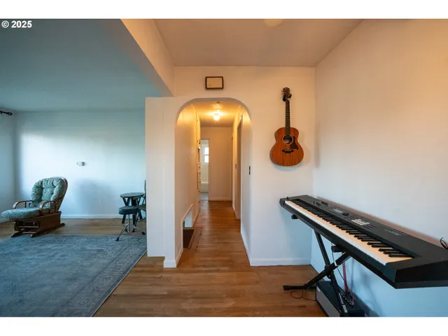 a view of dining room with furniture and wooden floor
