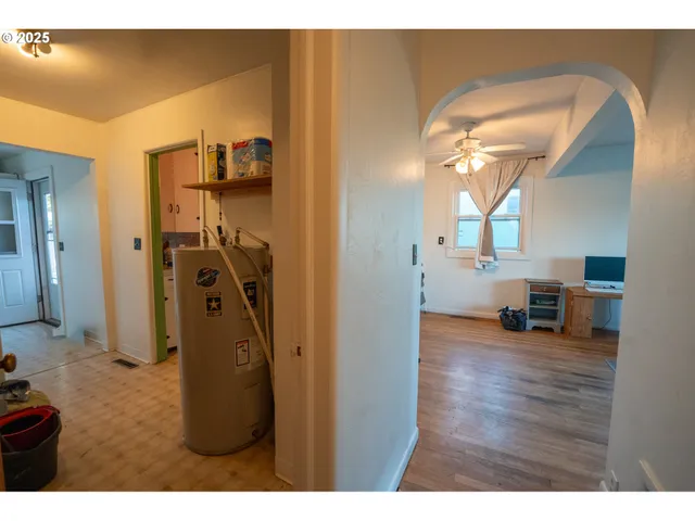 a view of a livingroom with furniture and a bedroom