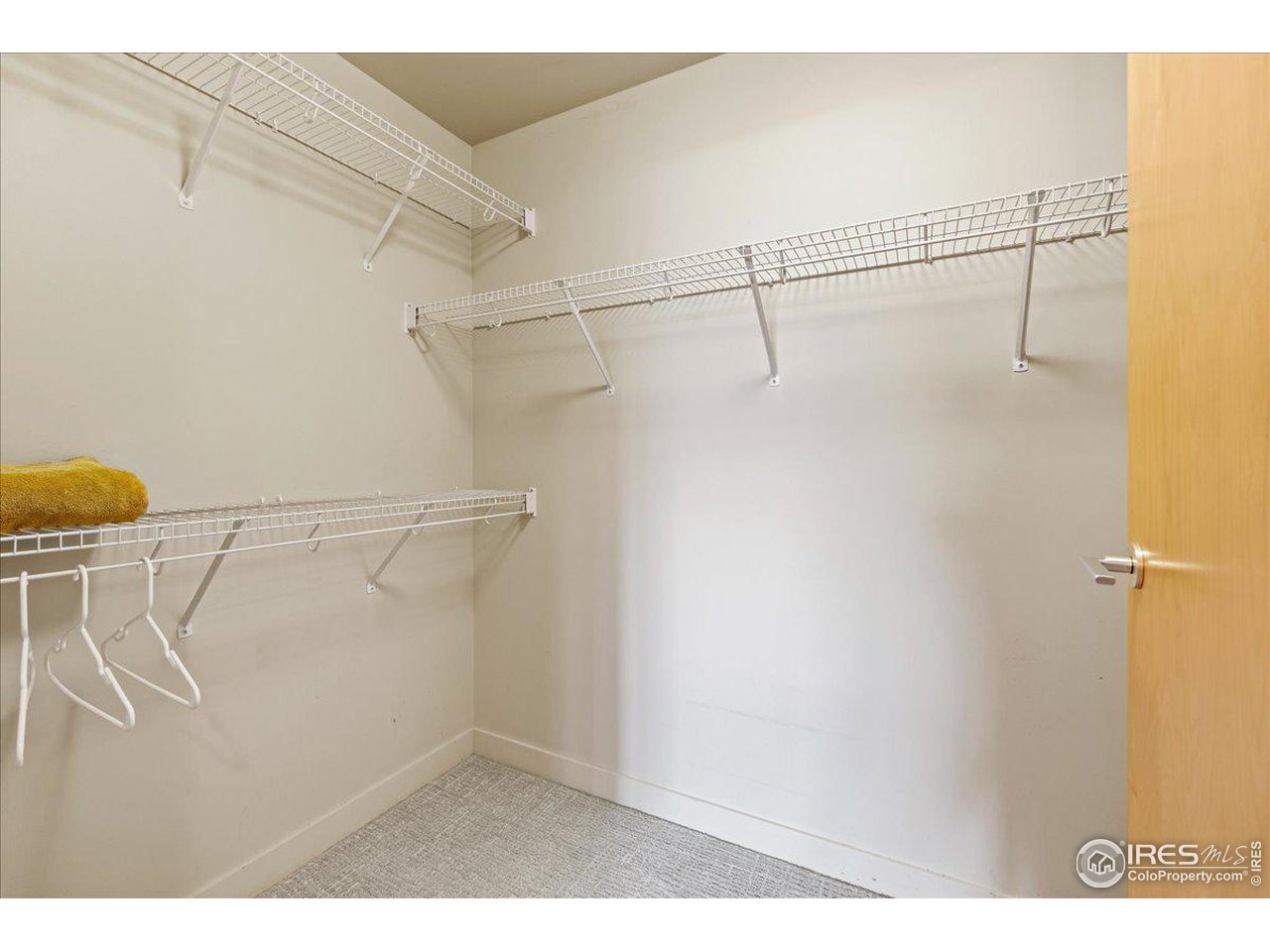 2229 Blake Street, Unit 402 Denver, CO 80205 - Photo 16 of 26 a view of a room with racks on the wall