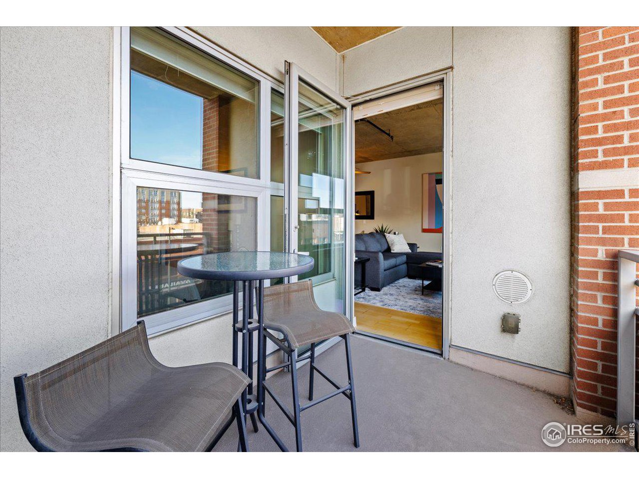 2229 Blake Street, Unit 402 Denver, CO 80205 - Photo 7 of 26 a view of a living room and dining room