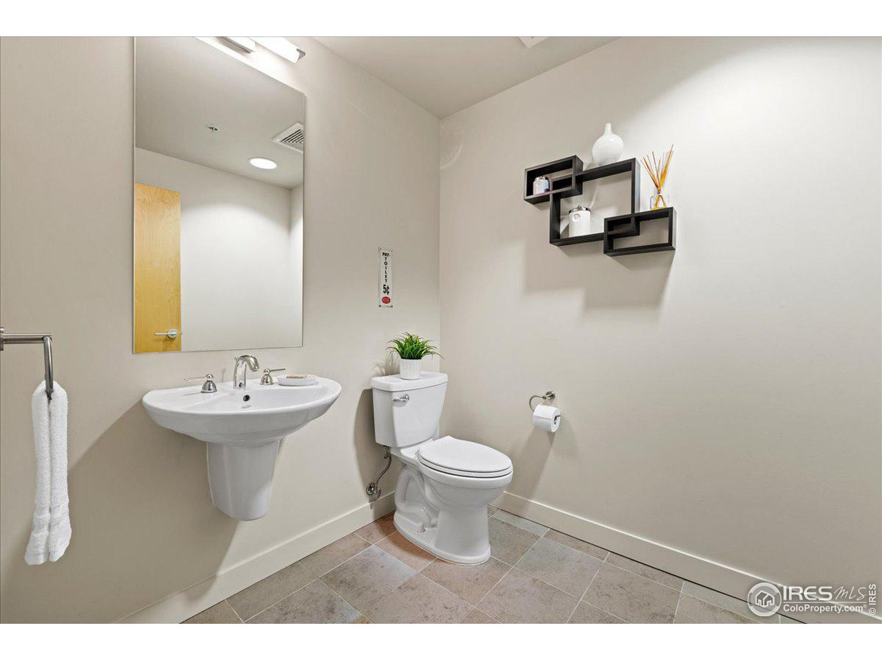 2229 Blake Street, Unit 402 Denver, CO 80205 - Photo 10 of 26 a bathroom with a sink toilet and a mirror