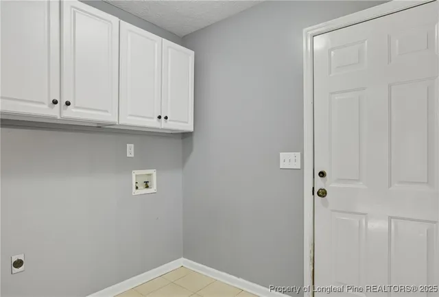 a view of small space with white cabinets