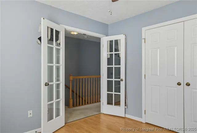 a view of entryway with wooden floor and door