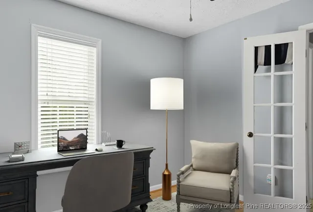 a work room with furniture and windows