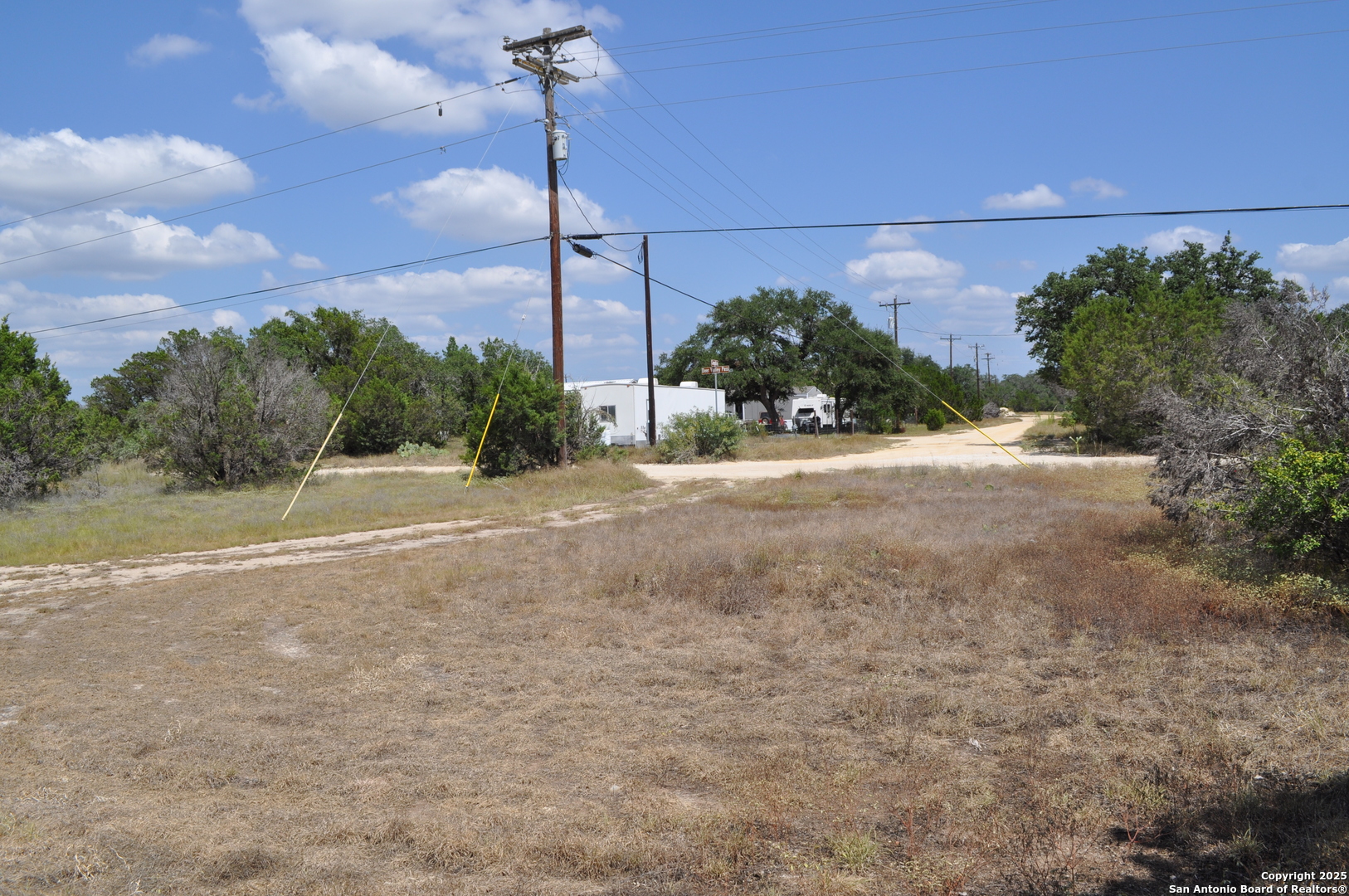 1608 Campfire Drive Spring Branch, TX 78070 - Photo 7 of 11 a view of a road with a building in the background