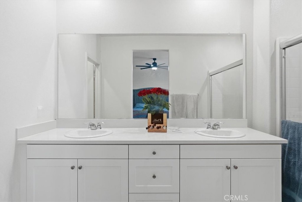 32350 Iron Trail Road Winchester, CA 92596 - Photo 19 of 32 a bathroom with a sink and a mirror