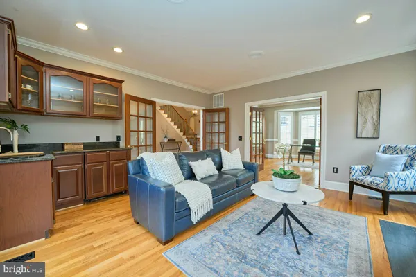 a kitchen with stainless steel appliances granite countertop a refrigerator a oven and a sink