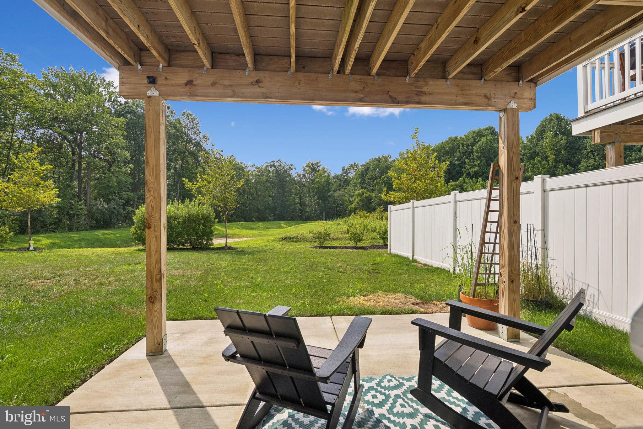 94 Aviary Road Thorofare, NJ 08086 - Photo 23 of 24 a view of a patio with a table chairs and a backyard
