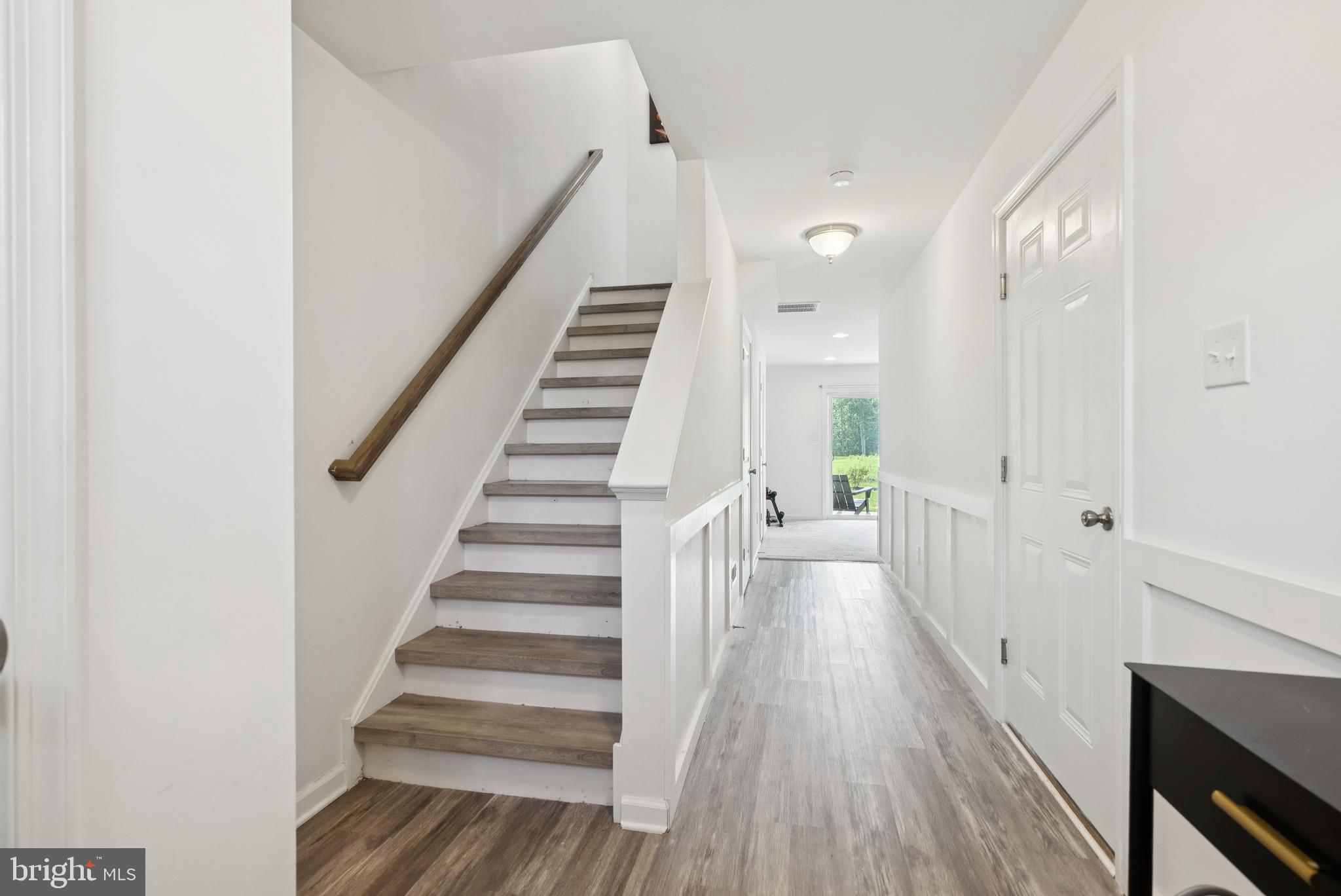 94 Aviary Road Thorofare, NJ 08086 - Photo 3 of 24 a view of a hallway with wooden floor and entryway
