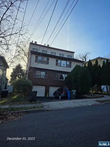 a view of a house with a street