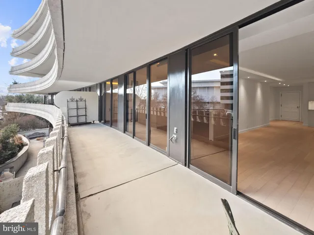 a view of house with yard and sitting area