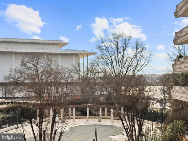 a view of a hallway with washer and dryer