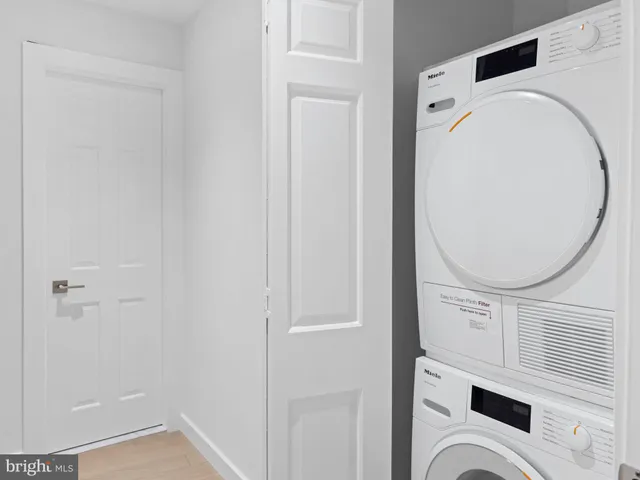 a view of staircase with white walls