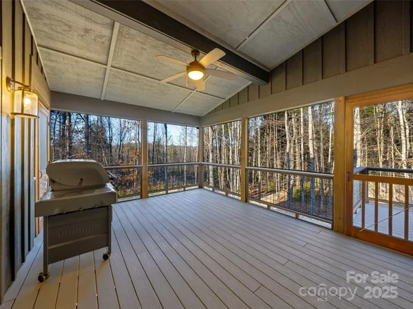 a room with wooden floor and furniture