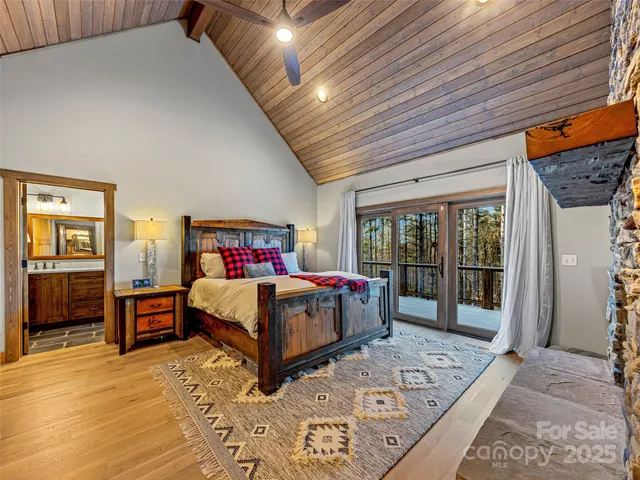 a bedroom with a large bed and a dresser