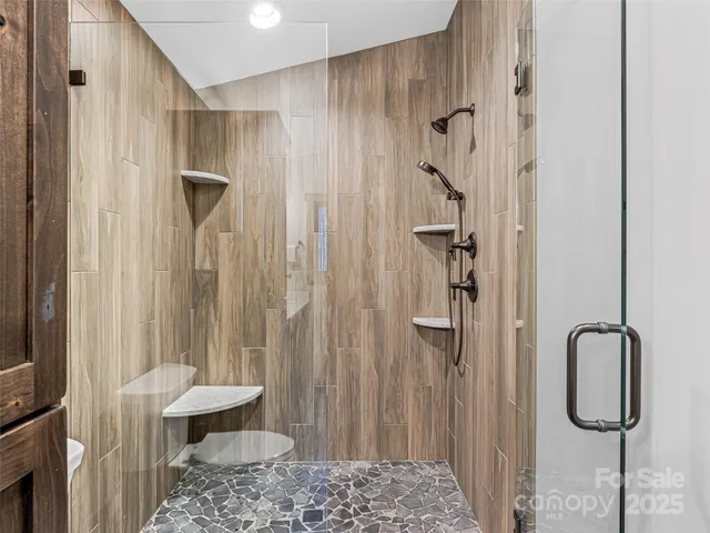 a bathroom with a shower and a toilet