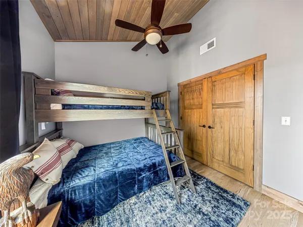 a bedroom with a bed and a walk in closet