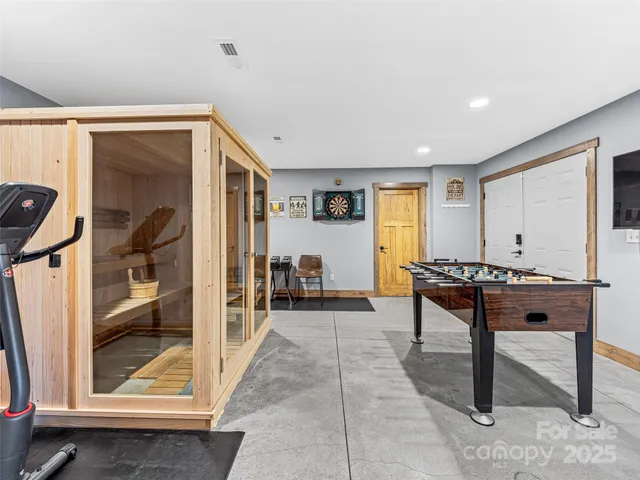 a living room with furniture a rug and a window