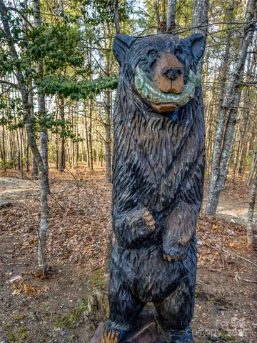 a view of balcony with wooden floor and fence